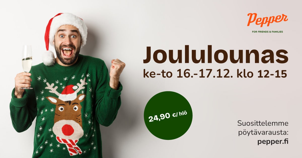 Iloinen mies, kädessään kuohuva lasi, päällä jouluneule ja päässään tonttulakki.